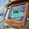 Pontchartrain Life sticker on a boat window with Lake Lodge Media logo.