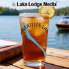 Glass of iced tea with a lemon slice, showing the text "Skaneateles Lake" and a compass.