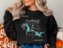 Black sweatshirt with "Lake Dardanelle Arkansas" map graphic and compass rose.