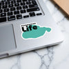 Pontchartrain Life sticker on a laptop, with green state outline and copyright text.