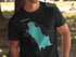 Black t-shirt with a teal outline map of Washington state and "Beautiful Cam Lake" text.