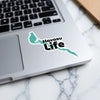 Aqua blue sticker with "Havasu Life" text on a laptop.