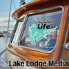 Big Sandy Life sticker on a wooden boat window, with Lake Lodge Media text below.