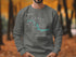Gray sweatshirt with "Beautiful Lake Sakakawea North Dakota" graphic and compass rose.