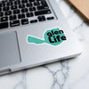 Teal sticker with black text "glen LIFE" on a laptop.