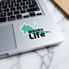 Granby Life sticker on a laptop keyboard with a turquoise lake silhouette.
