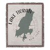 Woven blanket with Lake Tiorati outline, compass rose, and "New York" text.