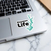 Keowee Life sticker with teal lake outline on a laptop.