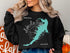 Black sweatshirt with turquoise Lake Las Vegas map and compass rose graphic.