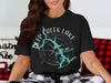 Black t-shirt with "Deep Creek Lake Maryland" text and compass graphic.