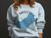 White sweatshirt with Lake Mascuppic, New Hampshire map and compass design.