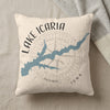 Lake Icaraia map on a cream pillow with a compass rose and "Iowa" text.