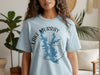 Light blue t-shirt with Lake Murray Oklahoma map and compass graphic.