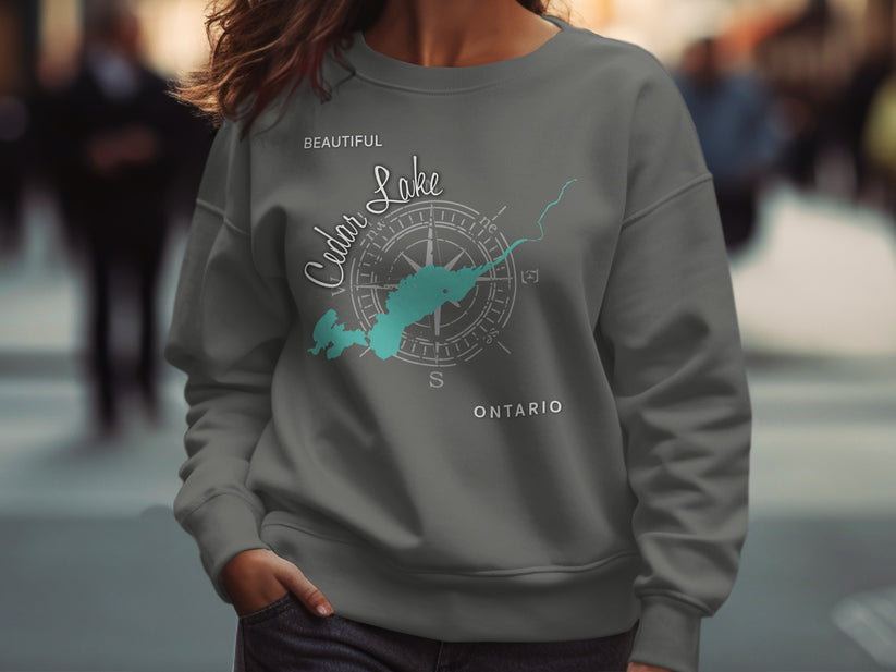 Gray sweatshirt with "Beautiful Cedar Lake Ontario" text and compass graphic.