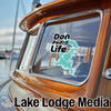 Don Pedro Life sticker on a boat window, with Lake Lodge Media logo at the bottom.