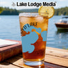 Glass with iced tea, lemon, and "Lake Lodge Media" logo over a lake scene.