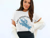 White t-shirt with Lake Winnipesaukee map and compass graphic, New Hampshire.