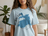 Light blue t-shirt with Big Lake Arizona graphic and compass rose.