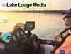 Man in boat with fishing electronics on a lake at sunset.