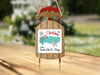 Christmas ornament shaped like a red sled with "Grand Lake St. Marys" text.