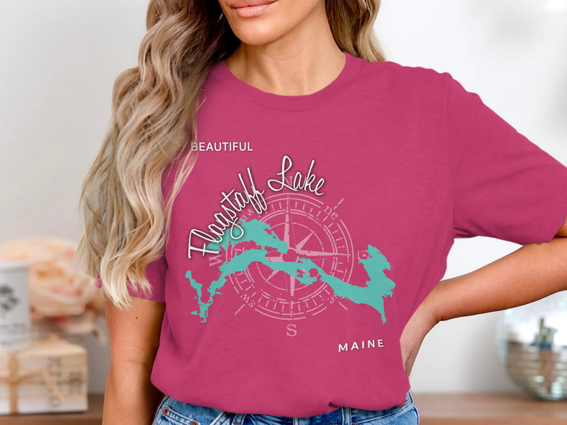 Turquoise Flagstaff Lake map graphic with compass on pink t-shirt.