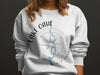 White sweatshirt with Lake Oahe North Dakota map and compass design.