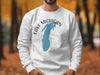 White crewneck sweatshirt with Lake Michigan and compass graphic.