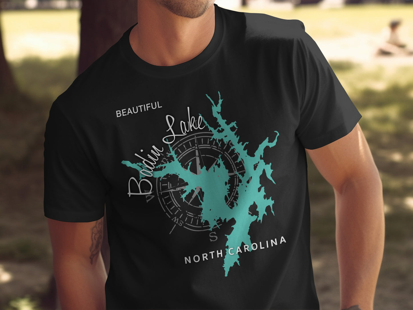 Black t-shirt with teal Bodkin Lake map and compass graphic.