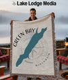 Green Bay Wisconsin map design on a fringed woven blanket held by a man.