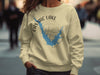 Castaic Lake California graphic on a cream sweatshirt with compass design.