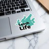 Teal Leech Lake shape sticker with "Leech Life" text on a laptop