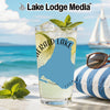 Glass of Emerald Lake drink with mint, lime, ice, and beach background.