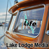 Skaneateles Life logo and Lake Lodge Media text on a wooden boat.