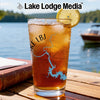 Glass of iced tea with lemon, Lake LBJ map graphic, and "Lake Lodge Media" logo.