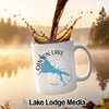 White mug with "Canyon Lake" and Arizona map design, pouring coffee.