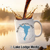 White mug with Black Canyon Lake Arizona map and compass design, coffee pouring.