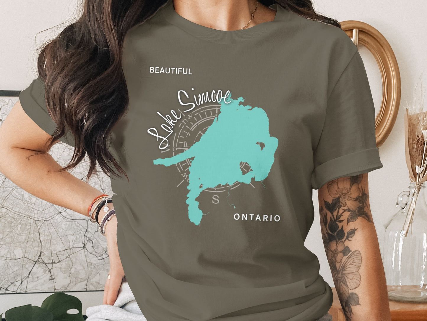 T-shirt with a turquoise outline of Lake Simcoe, Ontario map graphic.