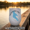 A white stainless steel wine tumbler with a Newfound Lake, New Hampshire graphic sits on a wooden dock.