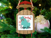 Christmas ornament shaped like a sled with text "Merry Christmas from Ossipee Lake".