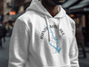 White hoodie with blue map outlines and compass graphic on front.