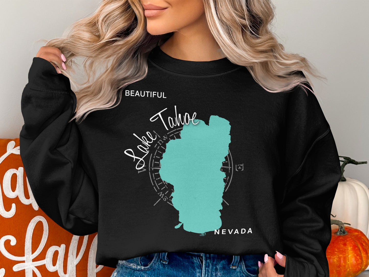 Black sweatshirt with turquoise Lake Tahoe map and "Beautiful Lake Tahoe Nevada" text.