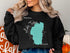 Black sweatshirt with turquoise Lake Tahoe map and "Beautiful Lake Tahoe Nevada" text.