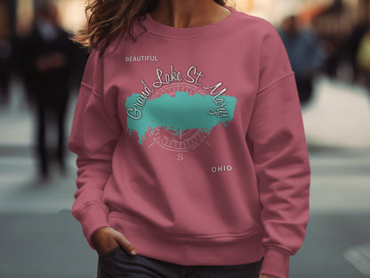 Pink sweatshirt with "Beautiful Grand Lake St. Marys Ohio" text and a teal outline.