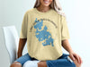 Yellow t-shirt with a blue map and compass graphic labeled "Lake Chaubunagungamaug Massachusetts".