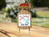 Sled ornament with text "Merry Christmas from Lake Anna" and snowflakes.