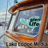 Turquoise Glen Life logo on a boat window, Lake Lodge Media text below.
