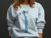 Light blue crewneck sweatshirt with Torch Lake Michigan design and compass graphic.