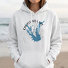 White hoodie with Calaveras Lake Texas map and compass rose graphic on chest.