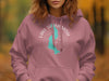 Pink hoodie with turquoise Lake Sammamish map and compass graphic.