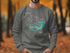 Gray sweatshirt with a compass graphic and "Wright Patman Lake Texas" text.